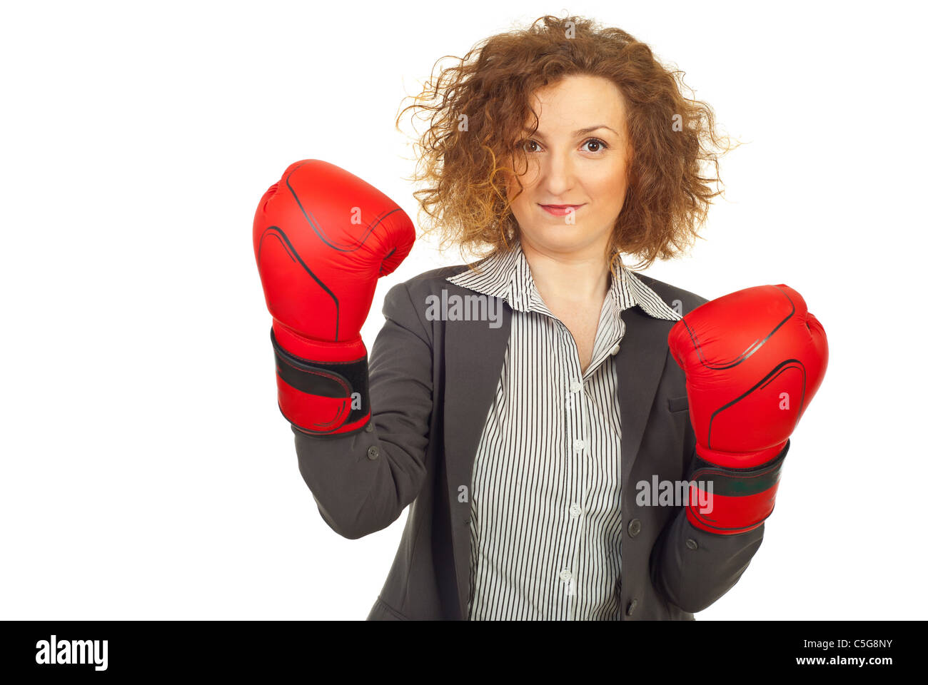 Successful business woman wearing boxing gloves isolated on white background Stock Photo