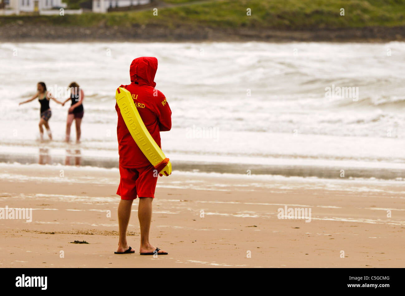 RNLI Lifeguard at the East Strand, Portrush Stock Photo
