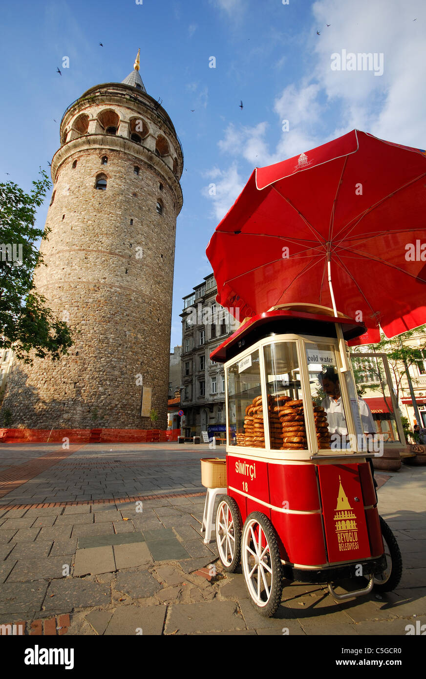 ISTANBUL, TURKEY. A cart selling simits (sesame-covered bread rings) by the Galata Tower in Beyoglu district. 2011. Stock Photo