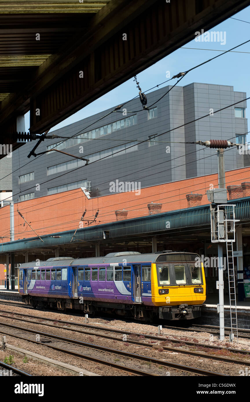 Class 142 train in Northern Rail livery waiting at a railway station in England. Stock Photo