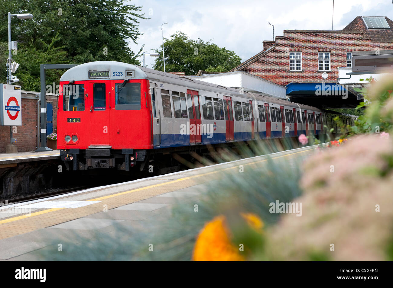 London Underground tube train traveling overground on the Metropolitan