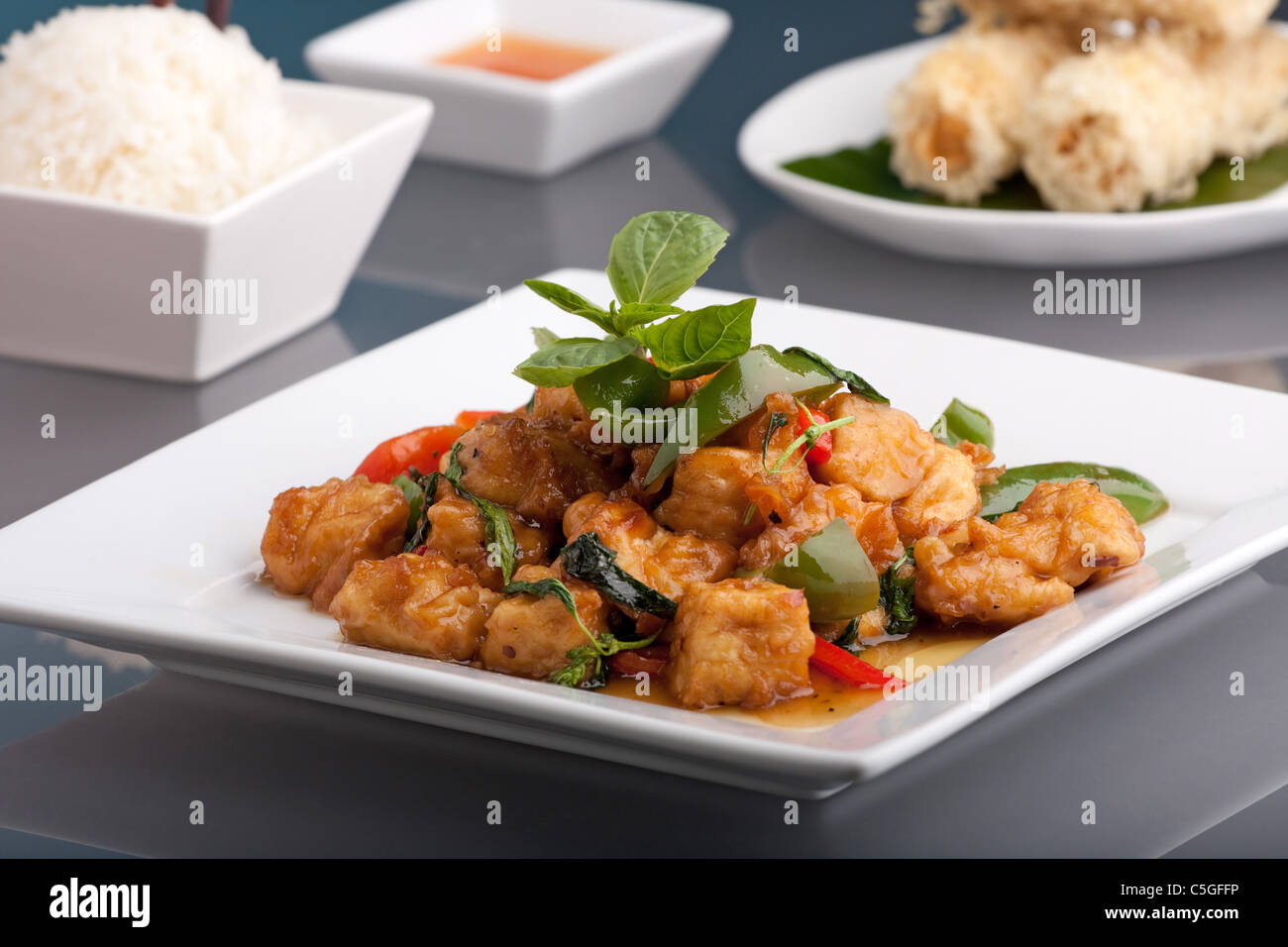 Fresh Thai food stir fry with tofu and white jasmine rice. Stock Photo