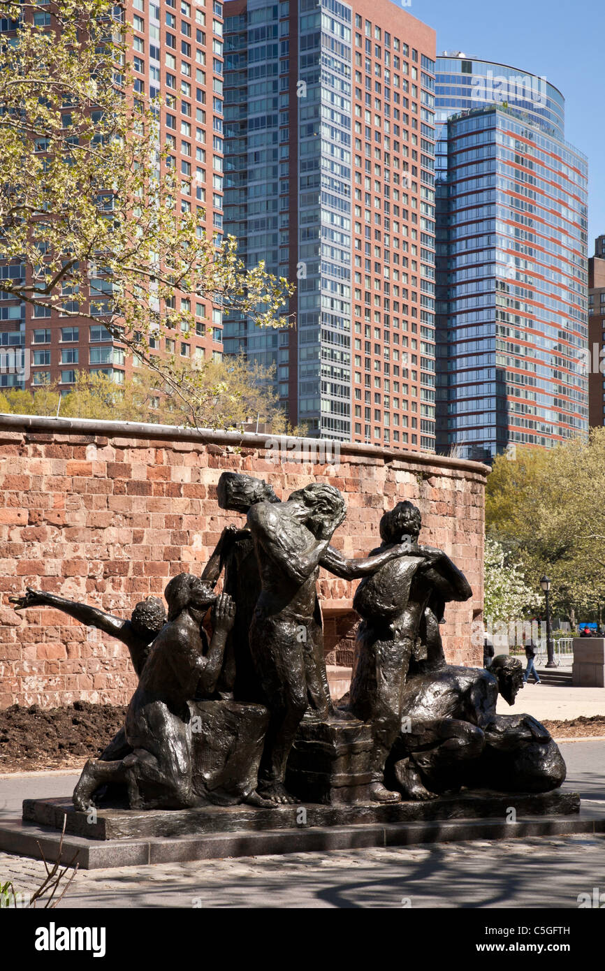 The Immigrants Statue, Battery Park, NYC Stock Photo