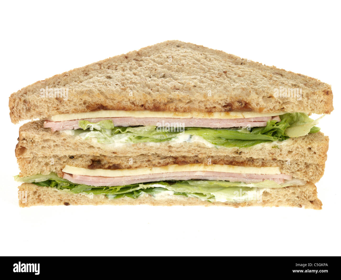 Fresh Ham Cheese And Pickle Sandwich Against A White Background With A