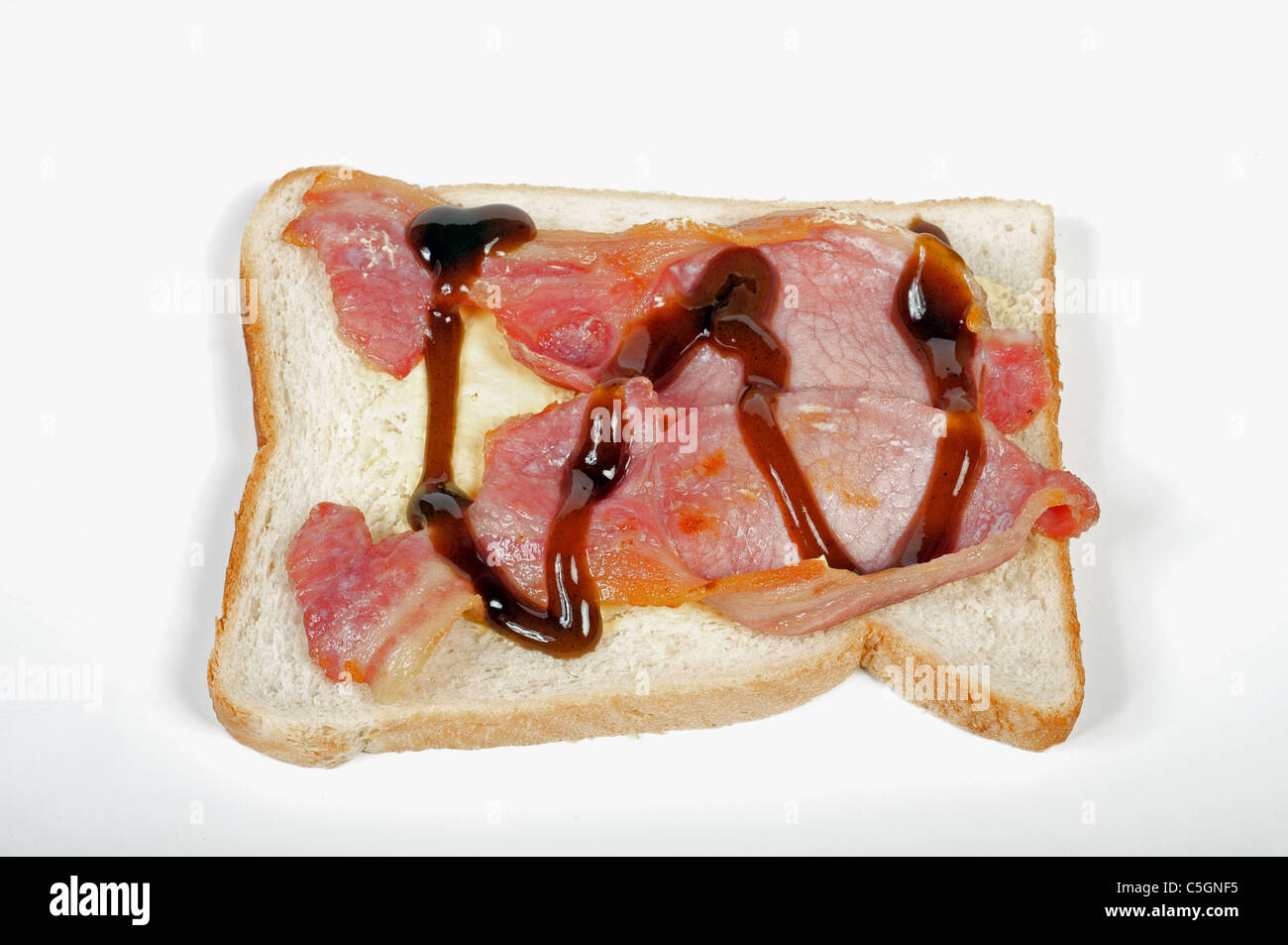 Bacon sandwich with brown sauce Stock Photo Alamy
