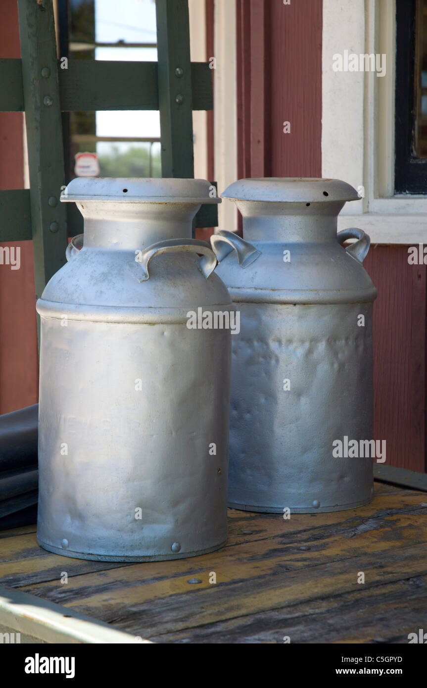 Antique farm milk containers Stock Photo