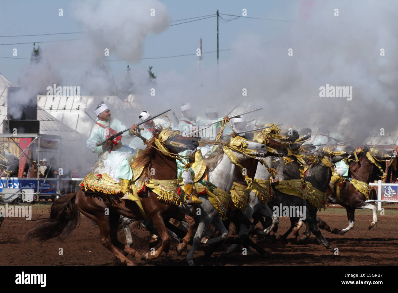 Cavalry Charge During a Moroccan Fantasia Performance Stock Photo
