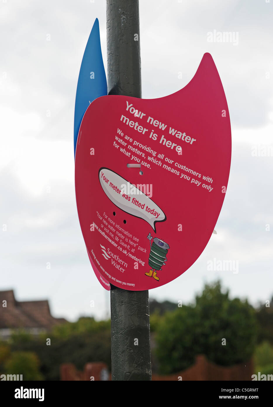 Water meter sign for households in street Littlehampton Sussex UK Stock Photo