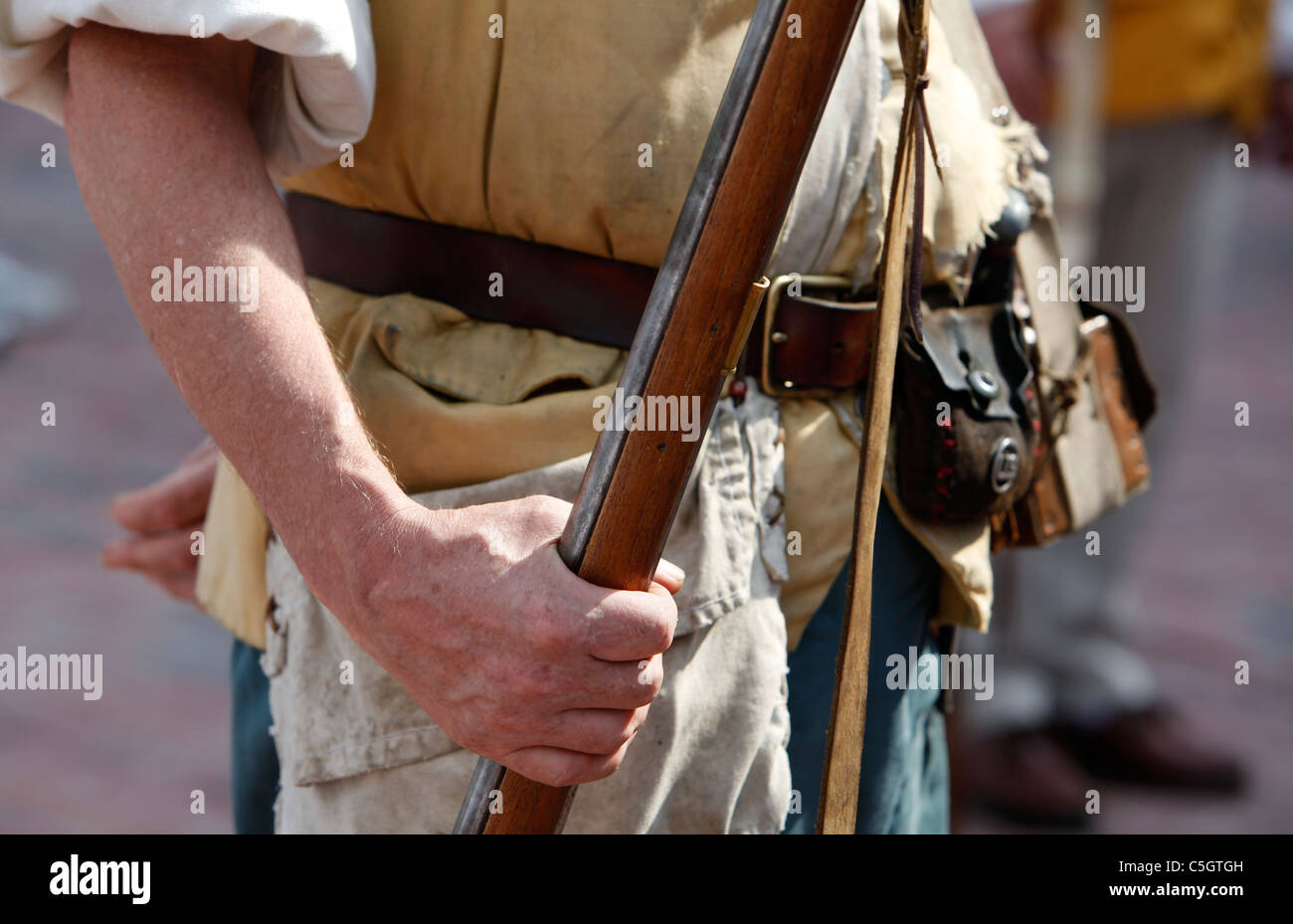American Revolutionary War reenactor grips his musket Stock Photo
