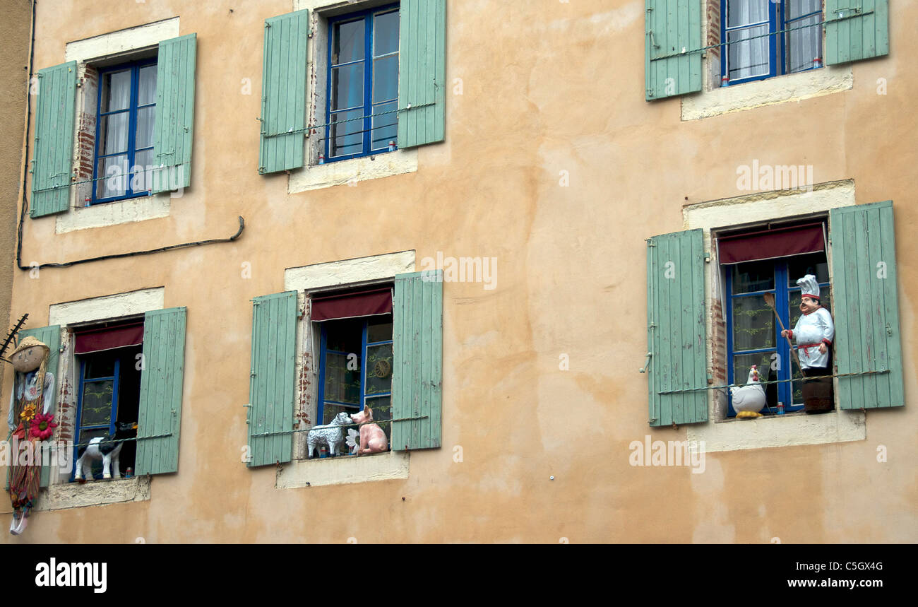 Hotel facade with figurines in windows Cahors France Stock Photo
