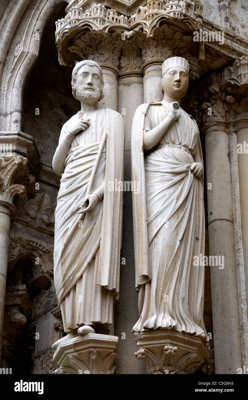 Two carved figures North Portal Chartres Cathedral France Stock Photo