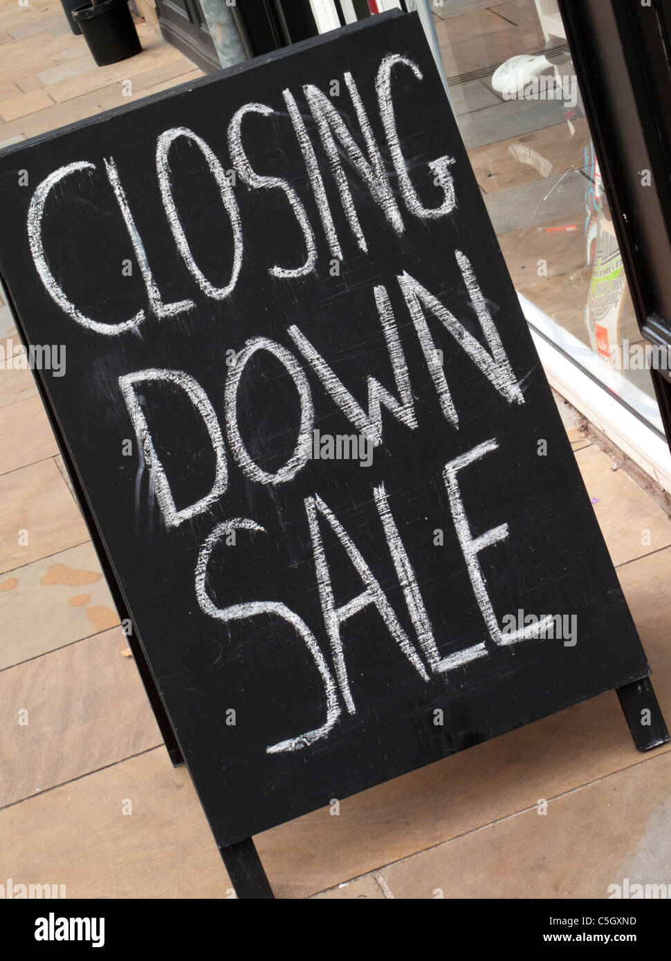 Closing Down Sale sign on pavement outside a shop Stock Photo