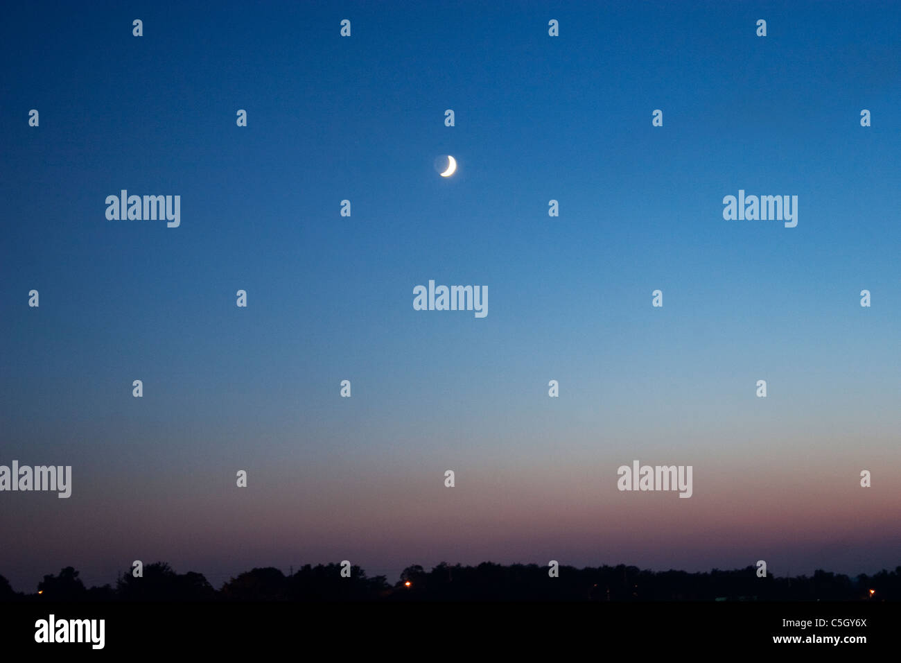 Moon rise over a summer rural landscape Stock Photo - Alamy