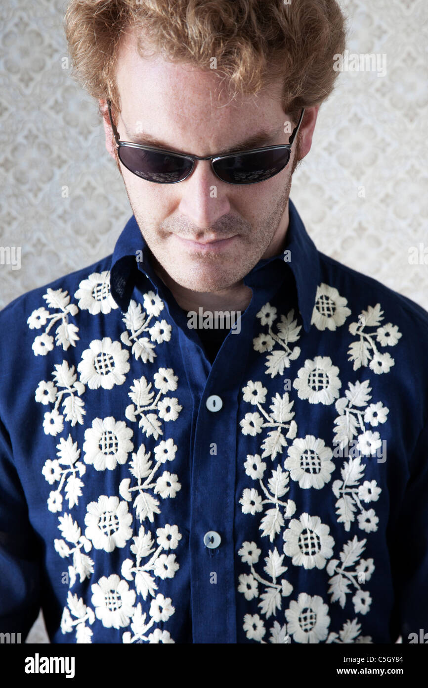 groovy guy in sunglasses and floral shirt Stock Photo