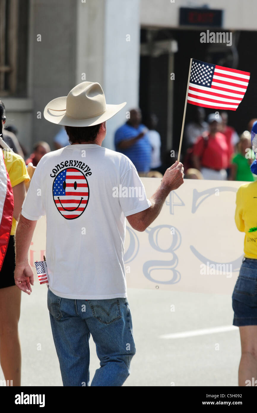 Man wearing a Conservative T-shirt at an Independence Day parade, USA Stock Photo