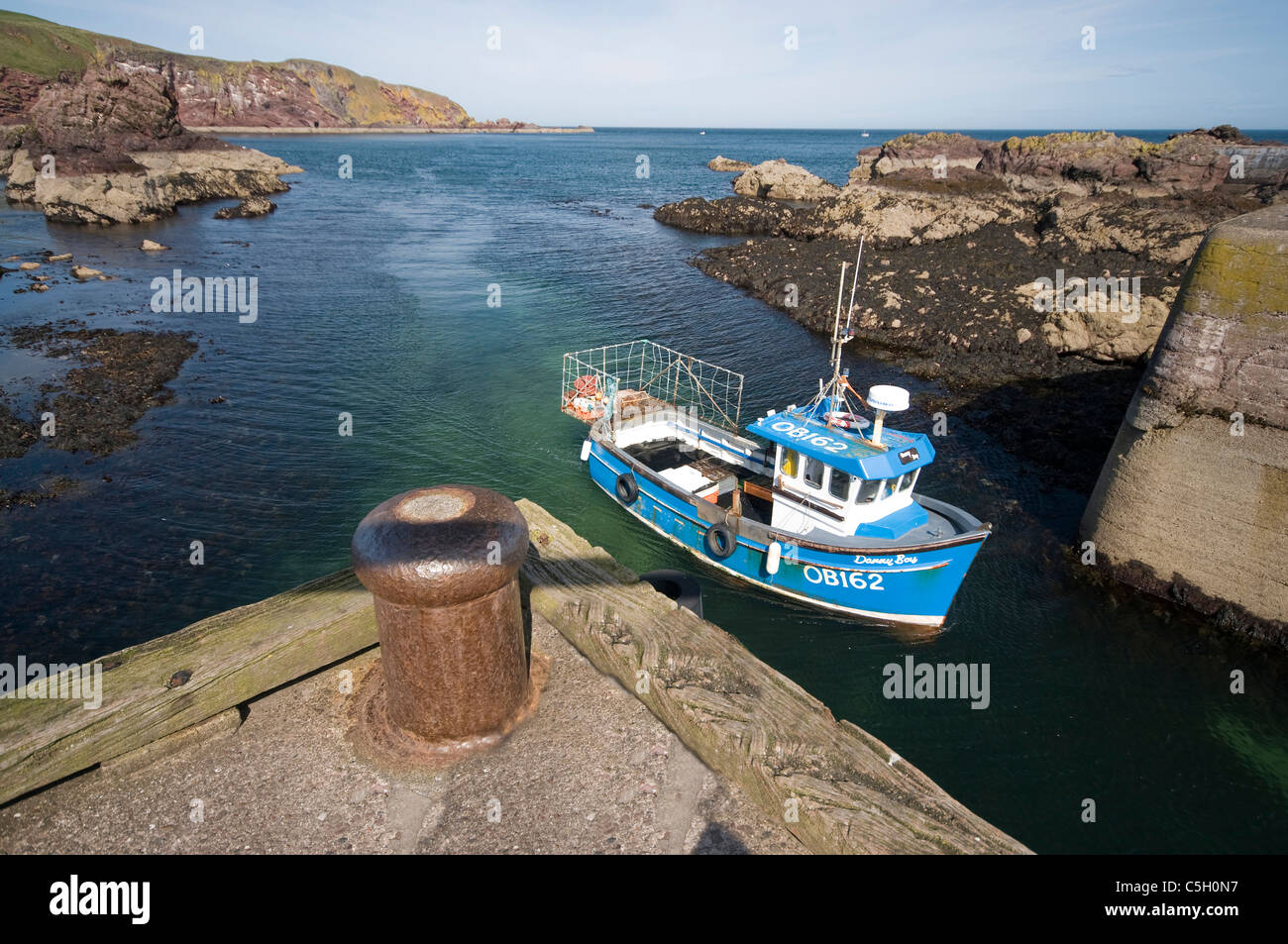 Inshore fishing vessels returns to port - St Abbs - Scottish Borders Stock Photo