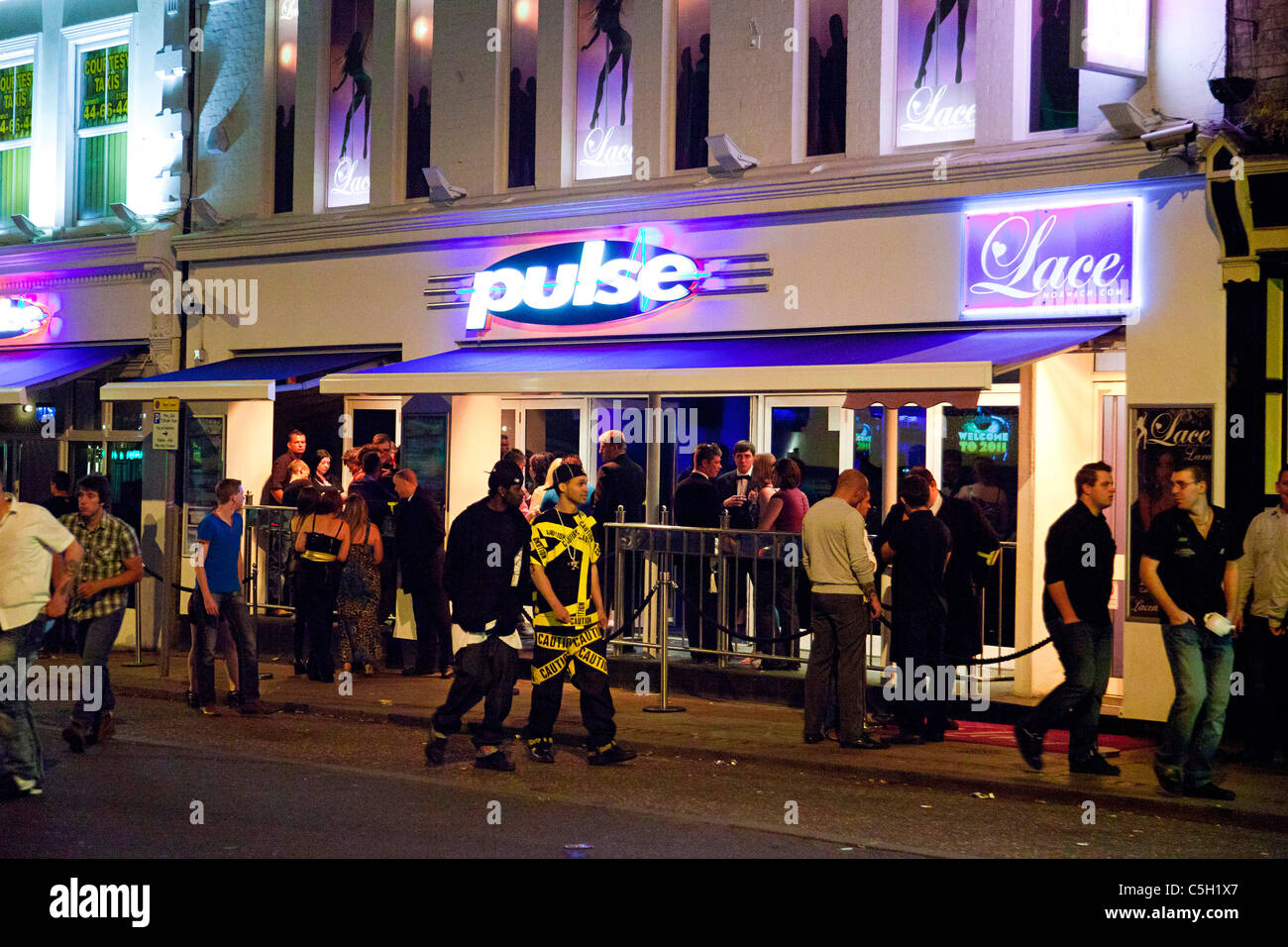 people gathered outside nightclubs and bars in Norwich, UK Stock Photo