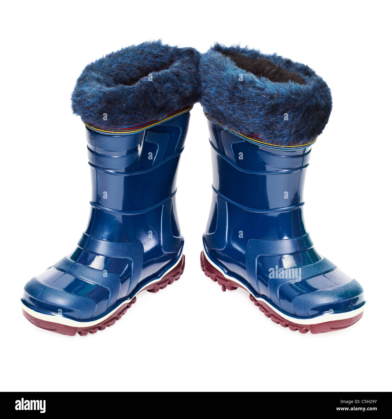 A pair of small rubber boots with artificial fur isolated on white