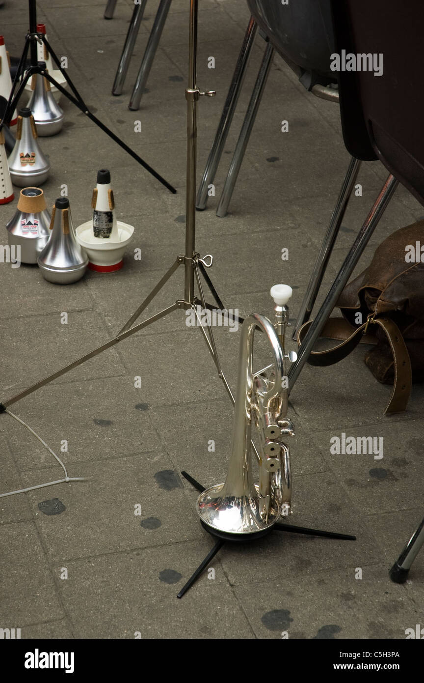 Trumpet on ground with music stands Stock Photo