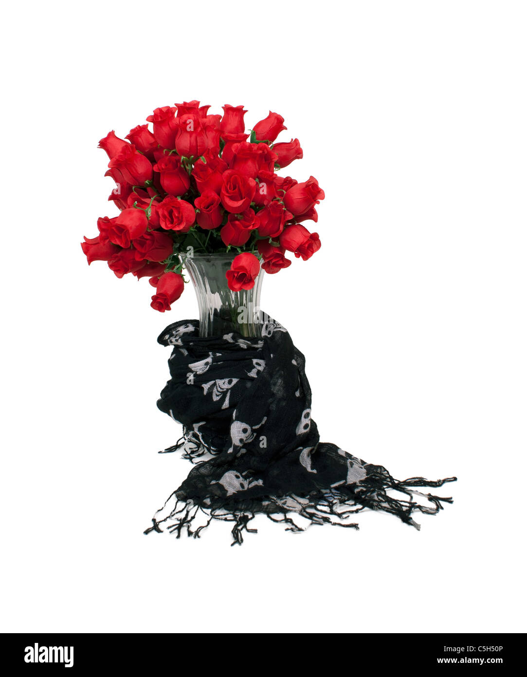 A dozen longstem red roses in a crystal vase wrapped in a black shawl