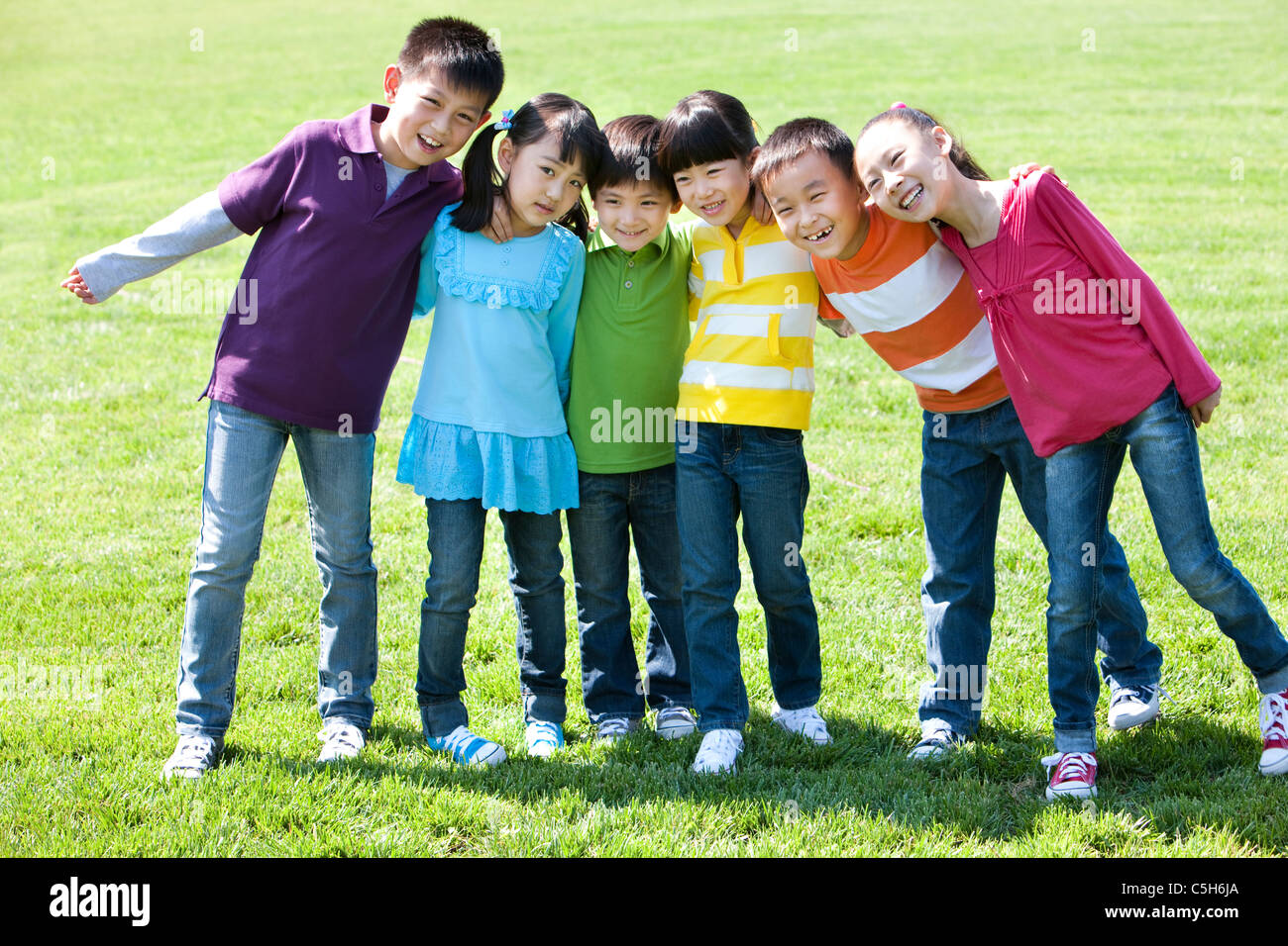 Children Posing for Picture at Park Stock Photo