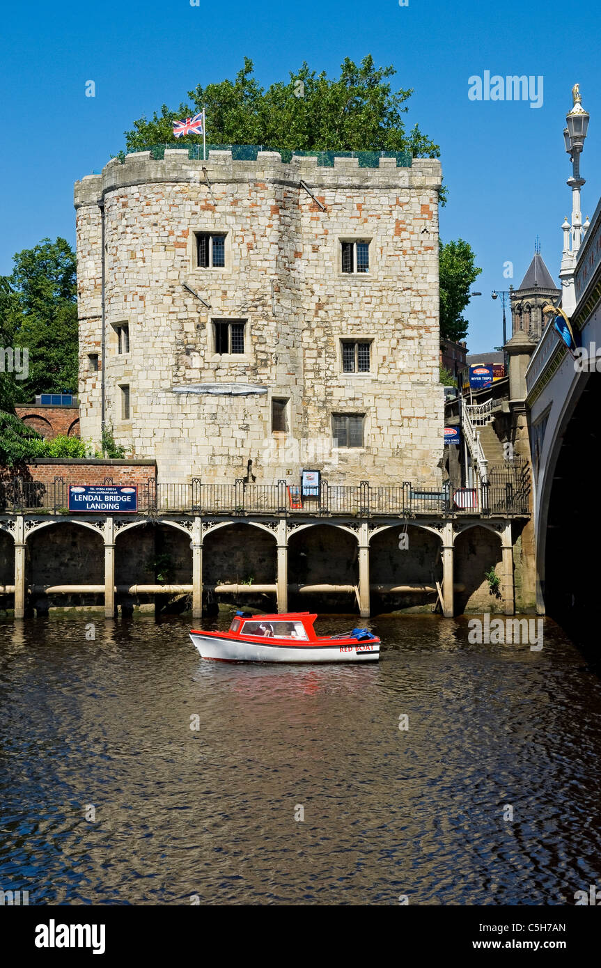 People tourists visitors on pleasure boat boats on River Ouse in summer Lendal Tower York North Yorkshire England UK United Kingdom GB Great  Britain Stock Photo