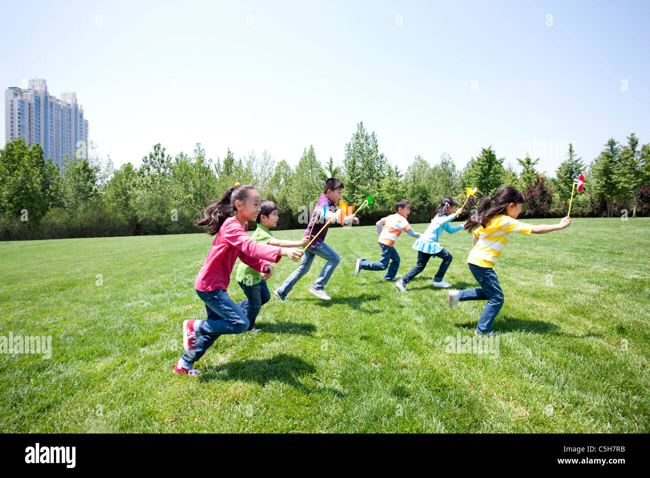 Children Playing in Field Stock Photo