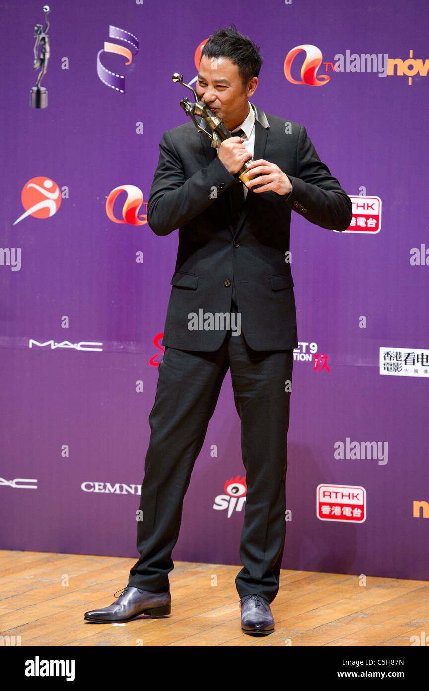 Actor Simon Yam celebrates winning the Best Actor award at the 29th ...