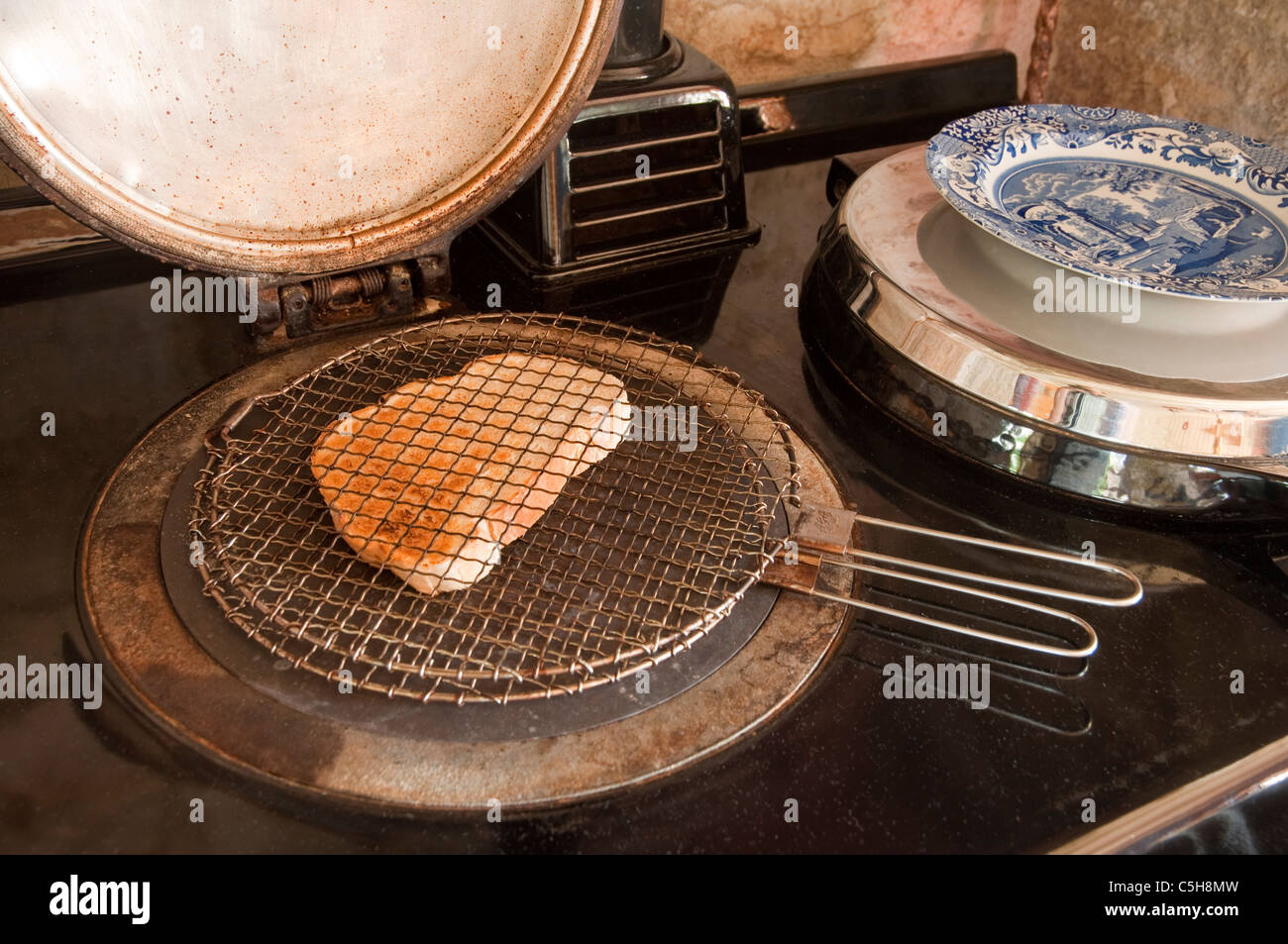 Making toast on an Aga cooker. UK Stock Photo