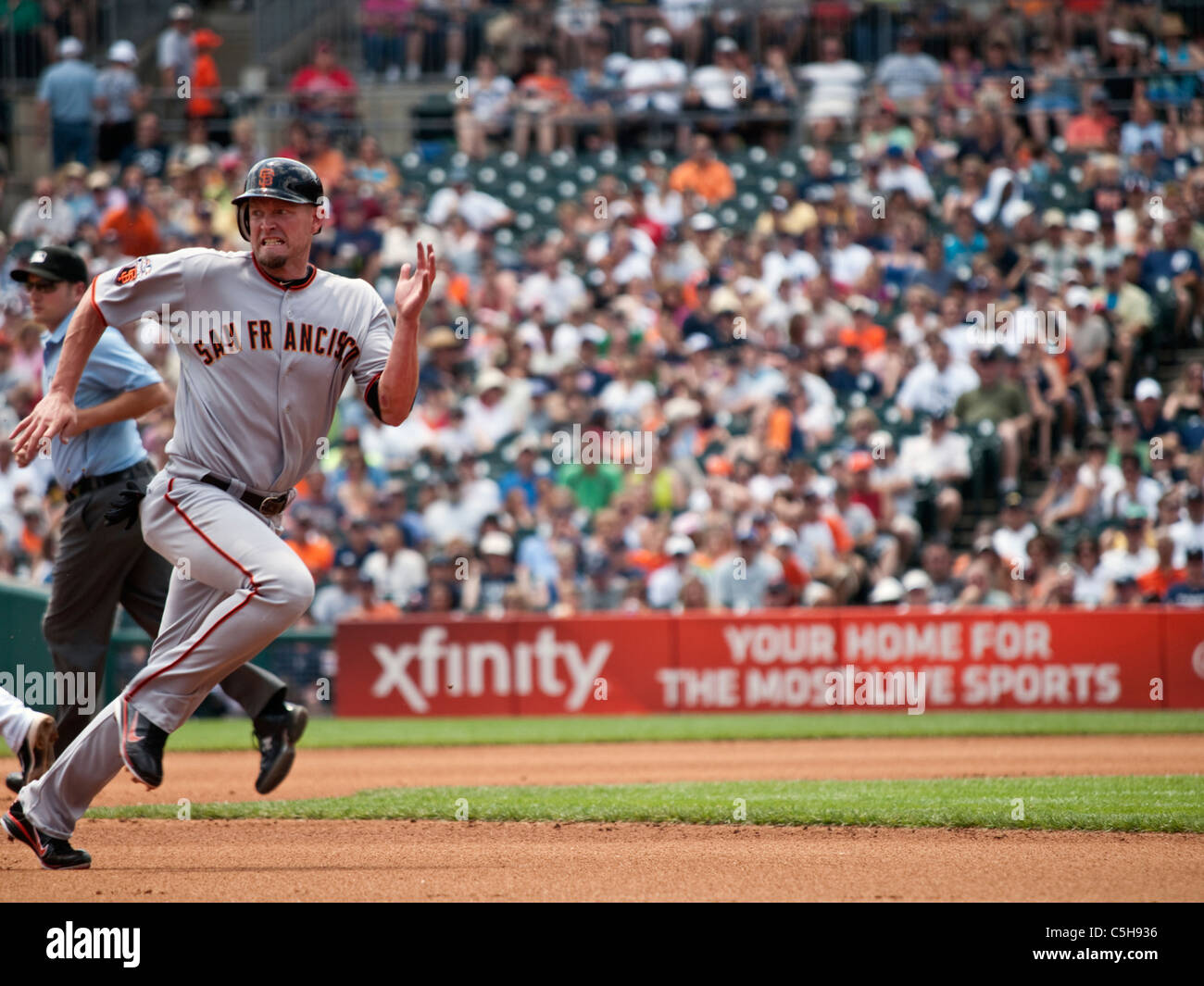 Aubrey Huff of the San Francisco Giants makes a run for third base Stock Photo