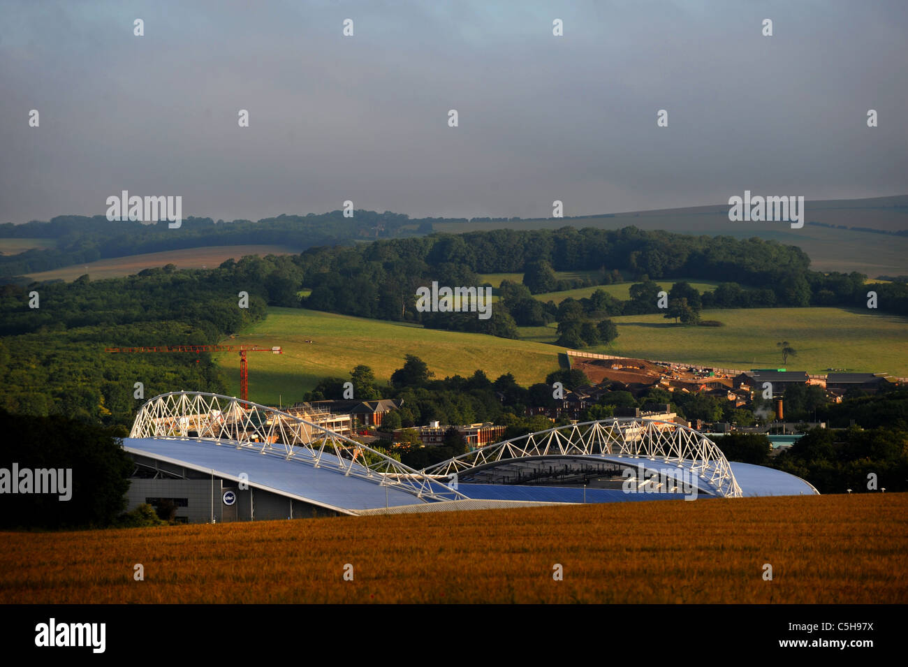 Brighton and Hove Albion's American Express Community stadium or Amex nestling in the hills of Falmer UK Stock Photo