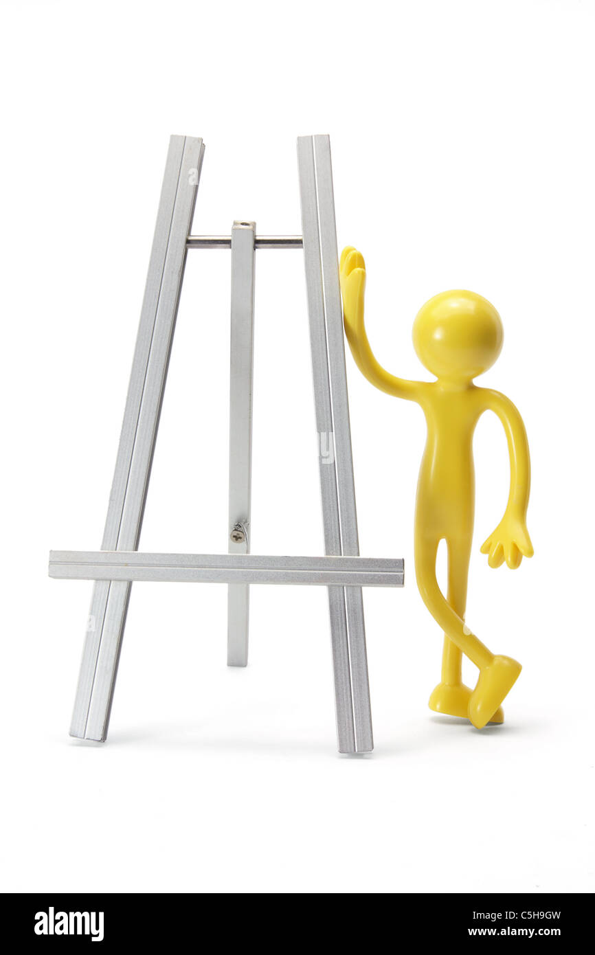 Miniature Rubber Figure and Easel Stock Photo