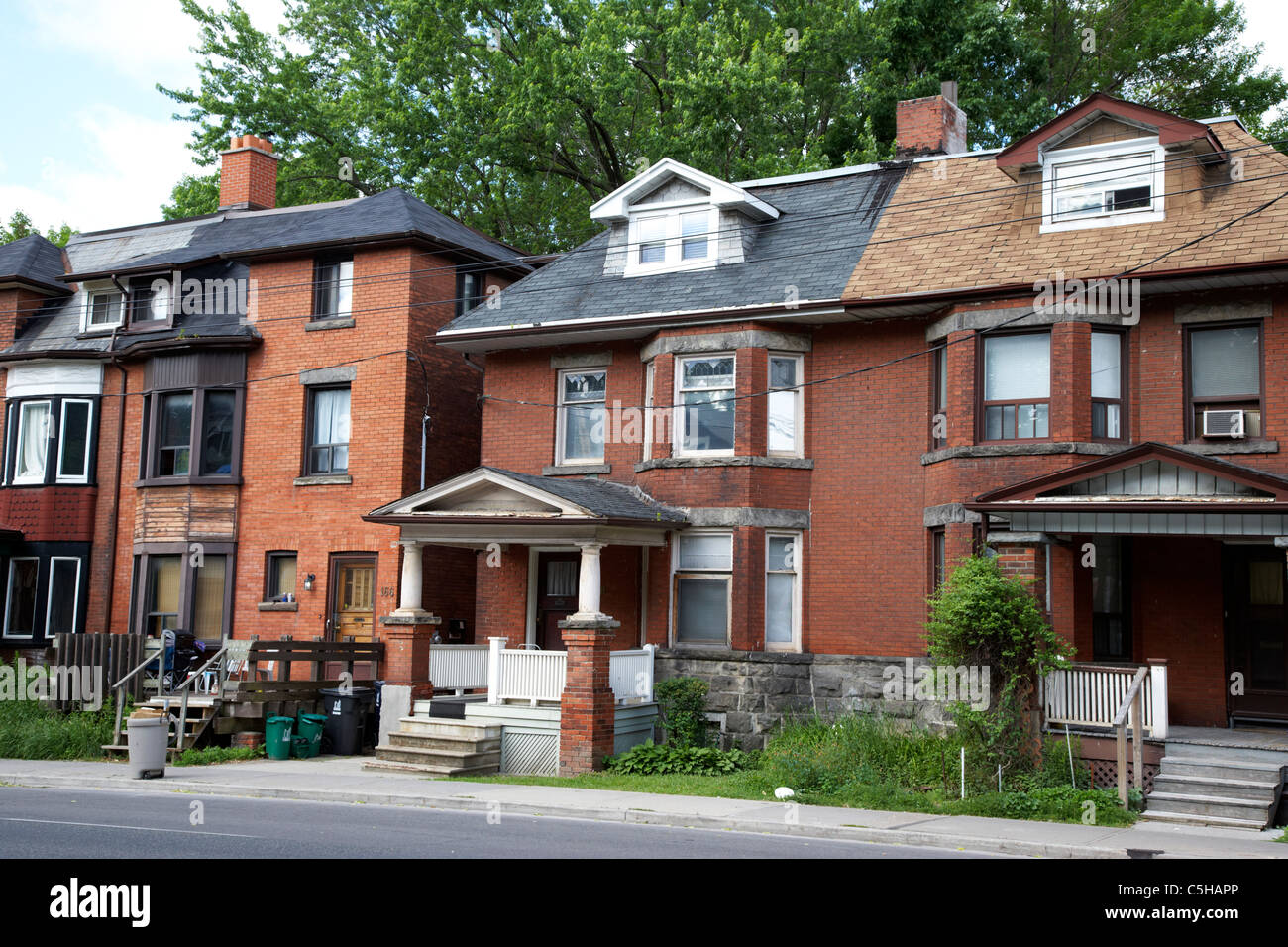 Red brick house with circular driveway and three car garage at twilight  Toronto Ontario Canada Stock Photo - Alamy