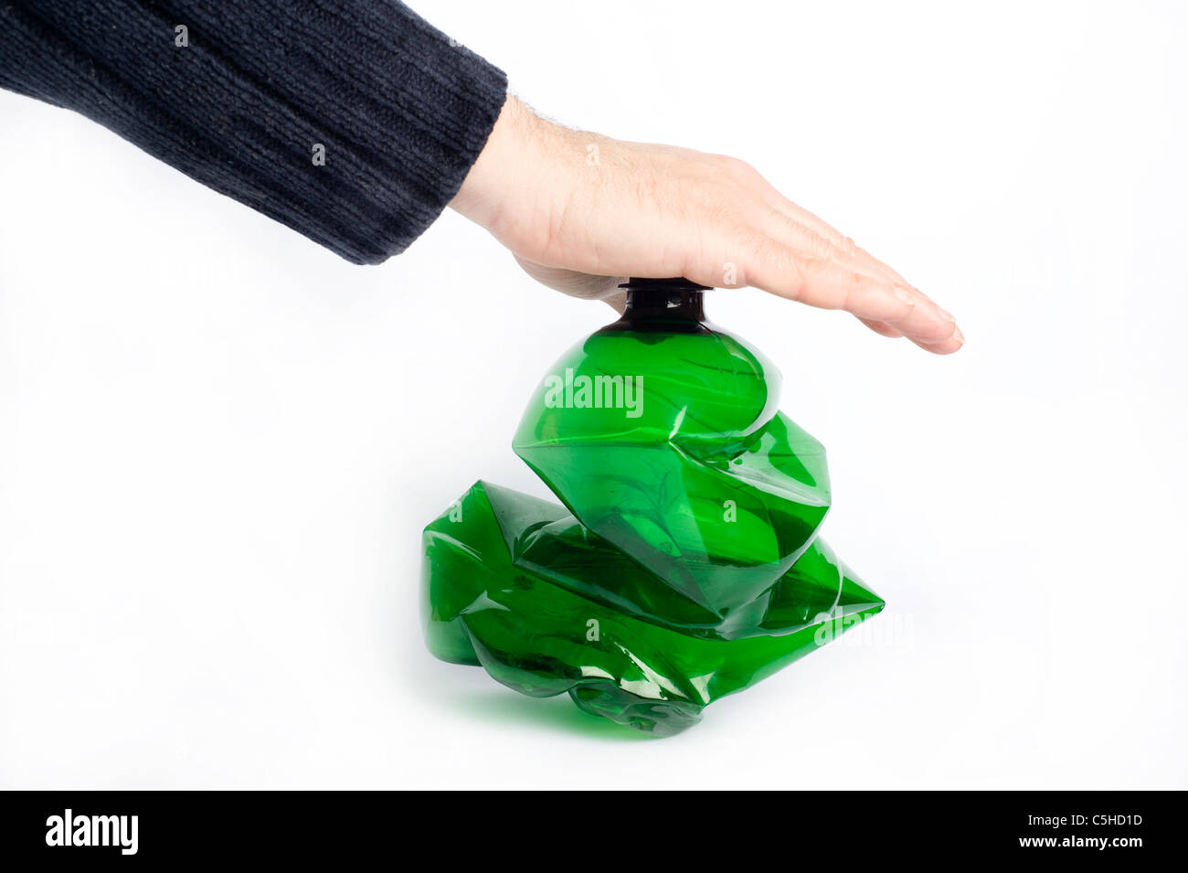 male hand crushing a plastic bottle, recycling concept Stock Photo Alamy