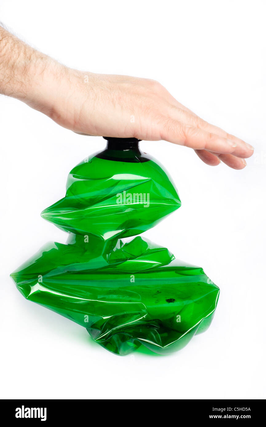 male hand crushing a plastic bottle, recycling concept Stock Photo Alamy