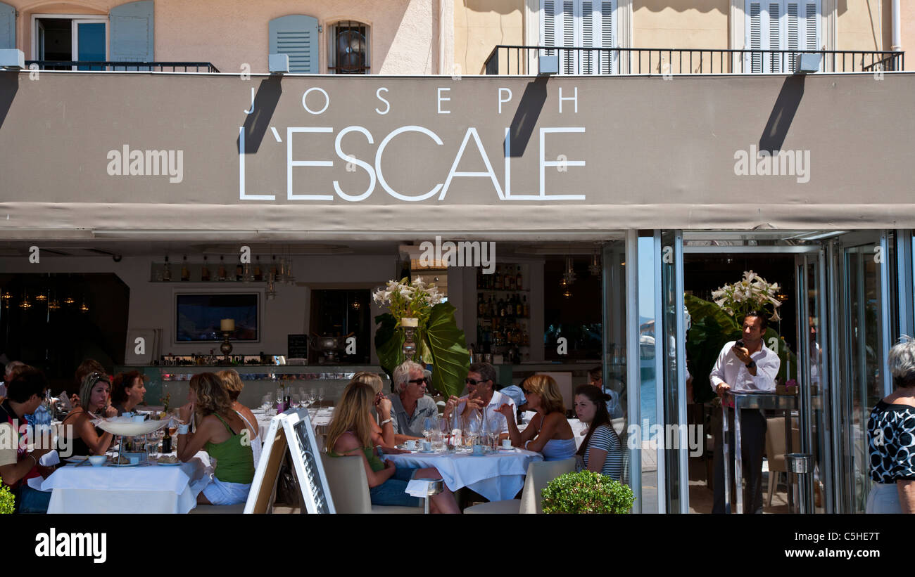 Seafront shops and restaurants, Saint Tropez, Cote d'Azure, Provence, France. Stock Photo