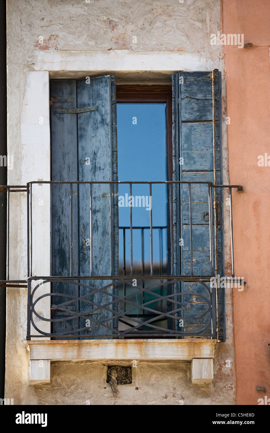 Window with wooden shutters and balcony, Venice, Italy Stock Photo