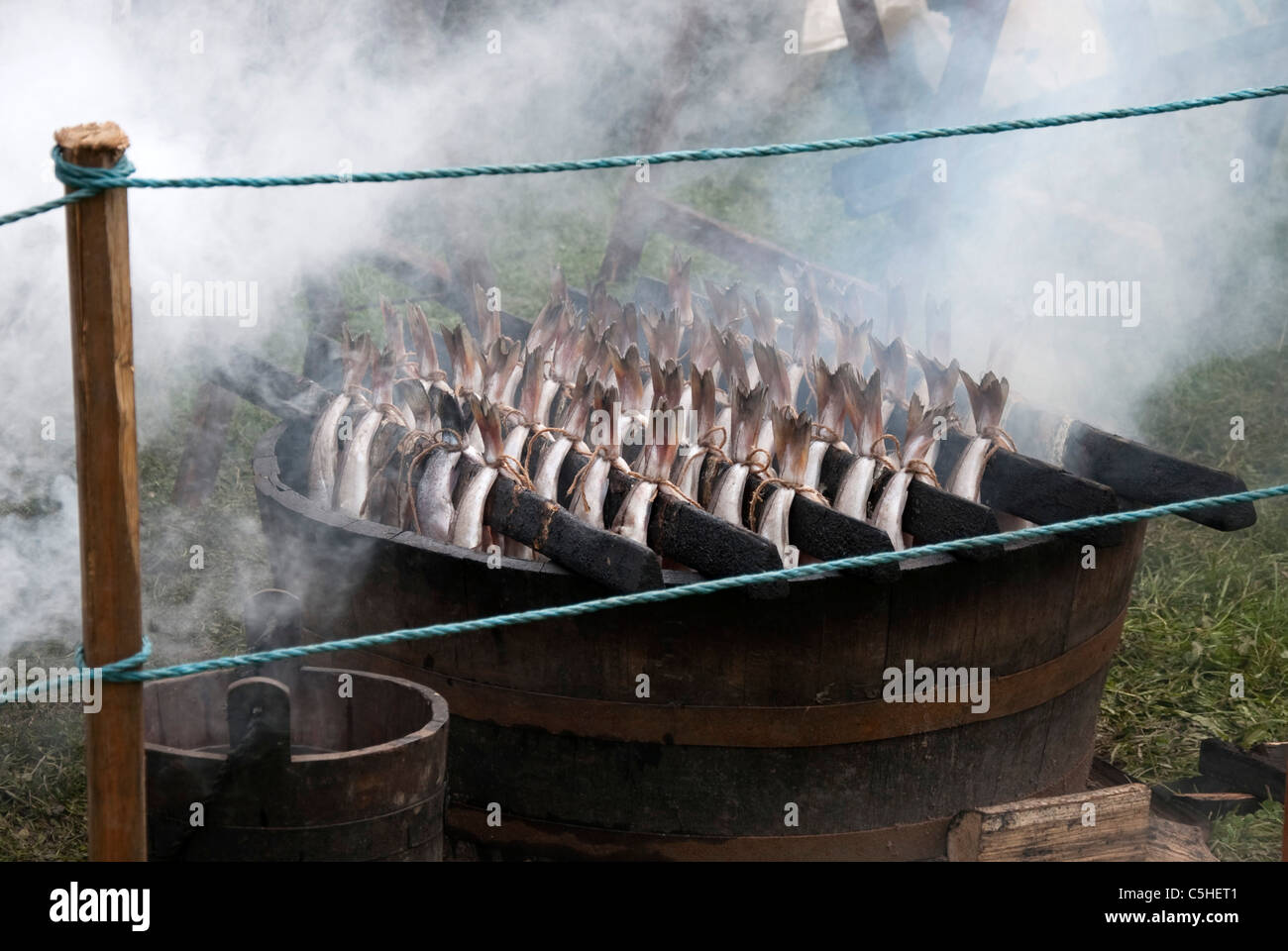 Pairs of Haddock being Smoked in an Oak Barrel Stock Photo