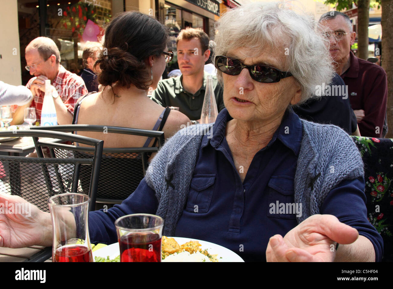 Diners eating lunch outside a Paris restaurant in Versailles Stock