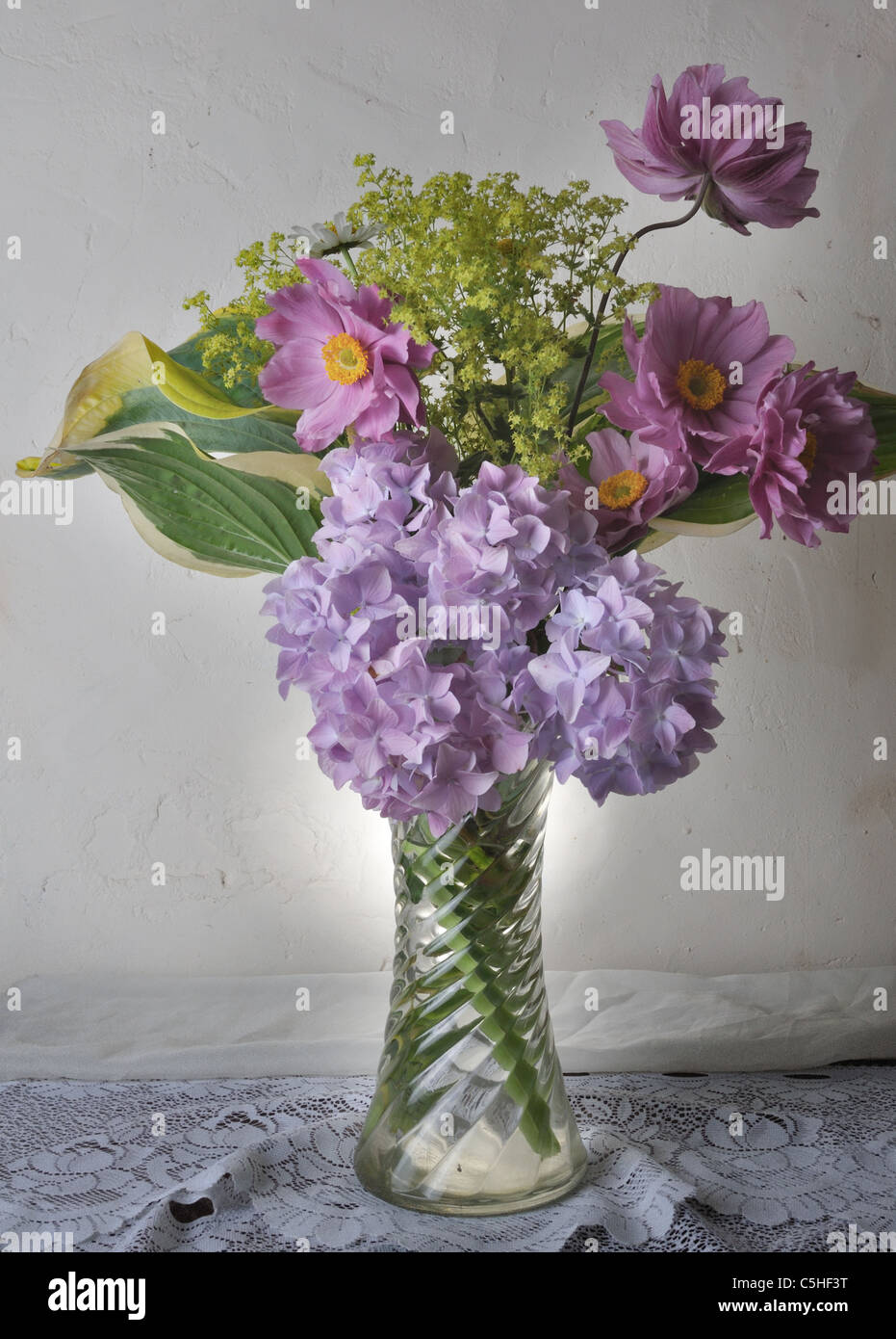 Flower arrangement in glass vase Stock Photo Alamy