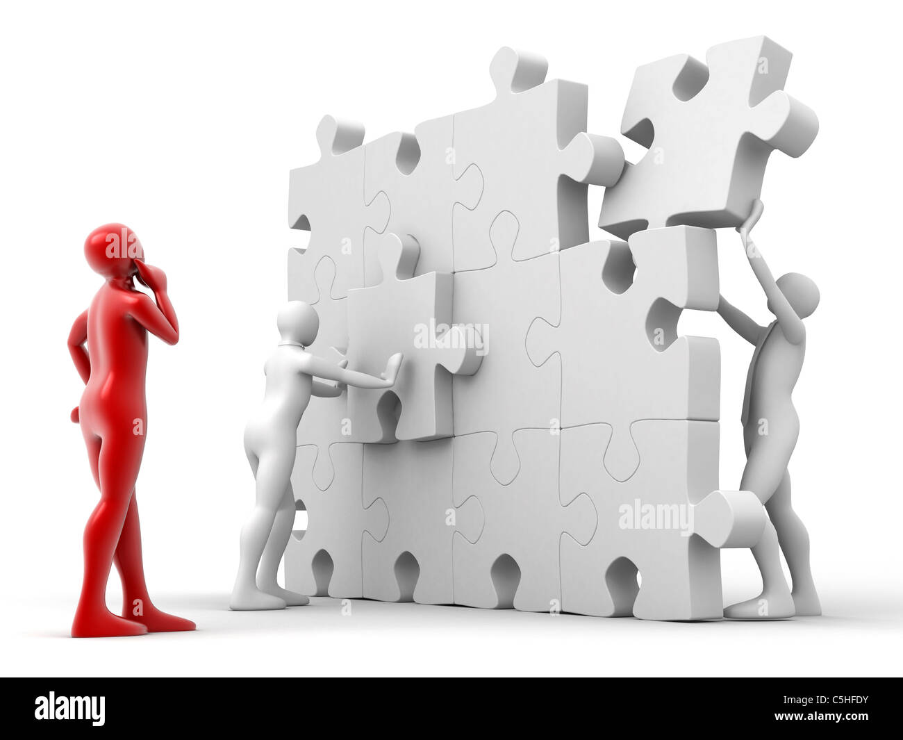 Men putting puzzle pieces together Stock Photo - Alamy