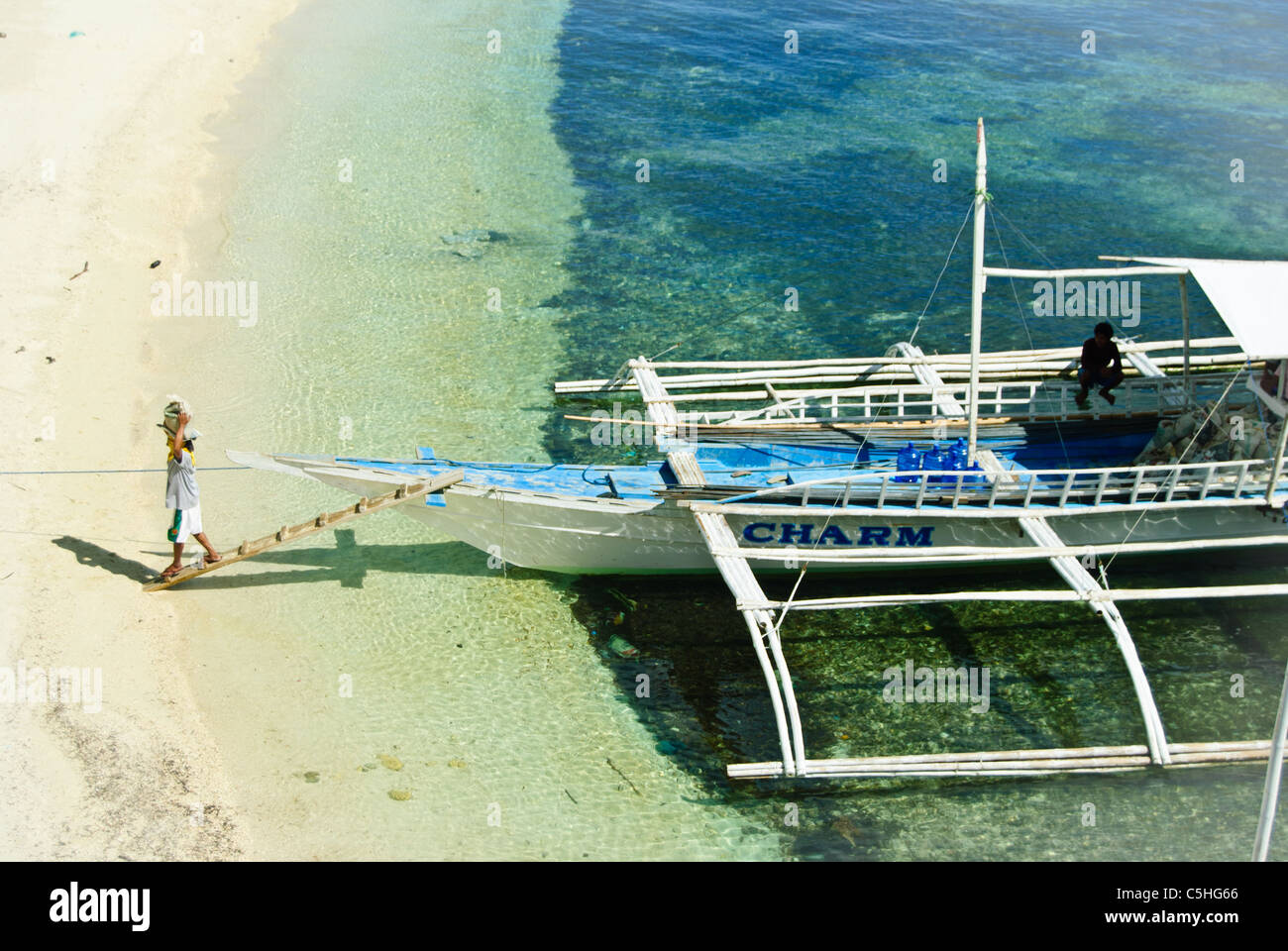 Outrigger as a delivery boat at Malapascua Island, Philippines Stock Photo
