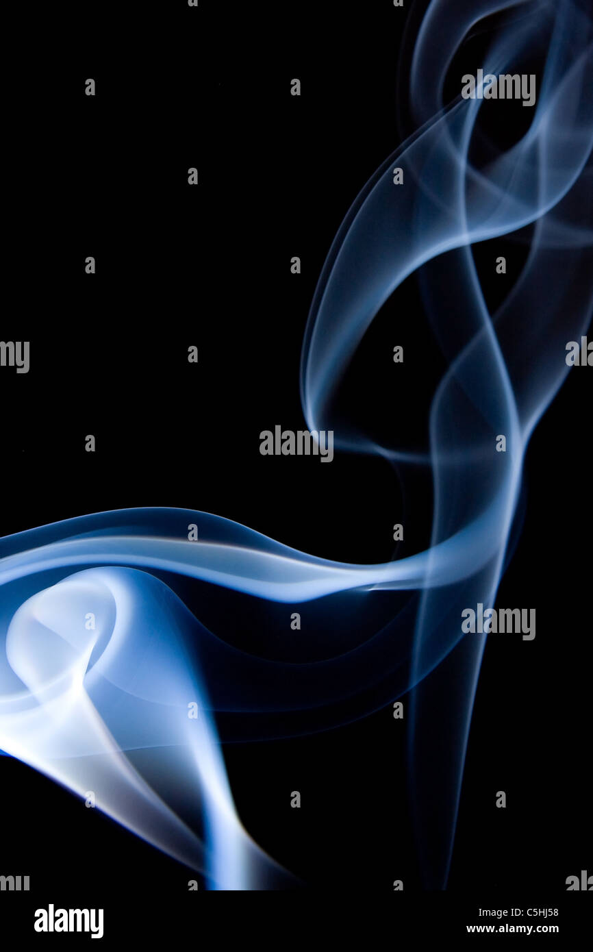 blue smoke isolated on black background Stock Photo - Alamy