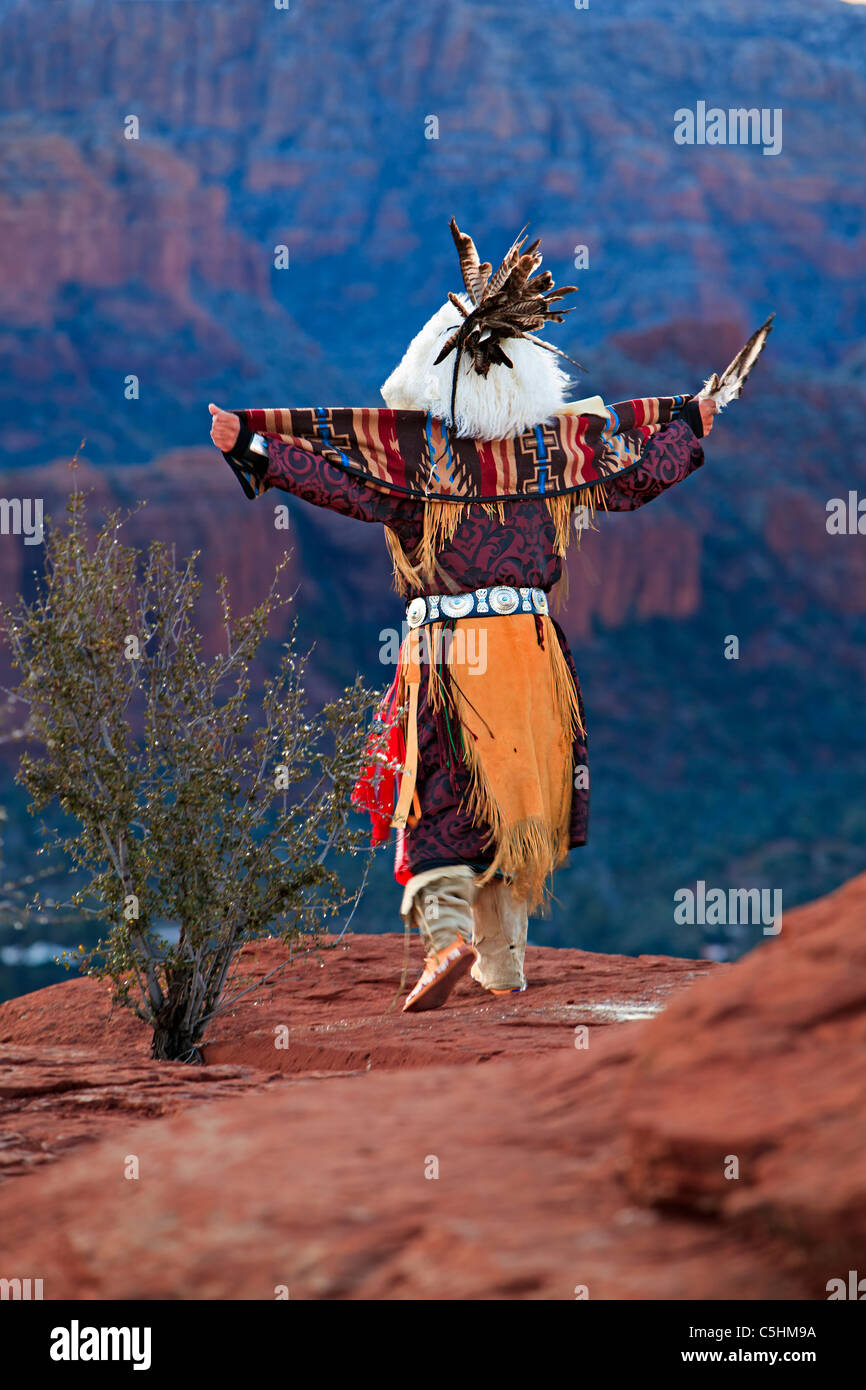 Native american (American Indian) celebrating the sunrise ceremony on top of a Mesa near Sedona