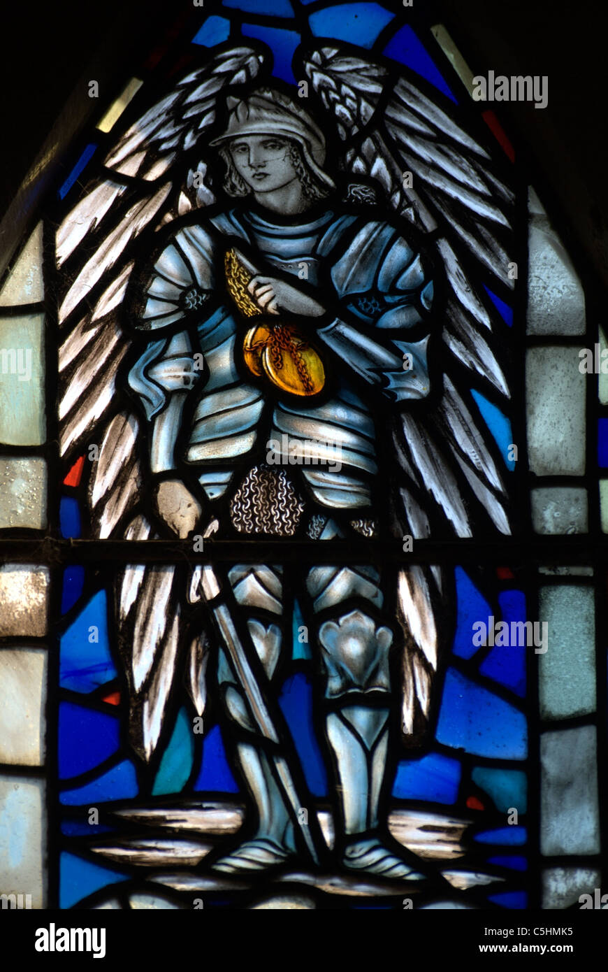 St.Michael the Archangel dressed in traditional armour with sword, and carrying Scales to weigh souls. Stock Photo