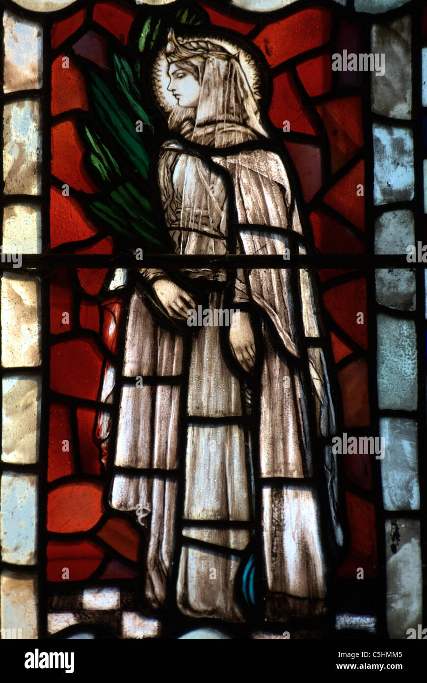 Section of stained glass depicting St.Agnes the patron Saint of young girls due to her chastity and refusal to marry. Stock Photo