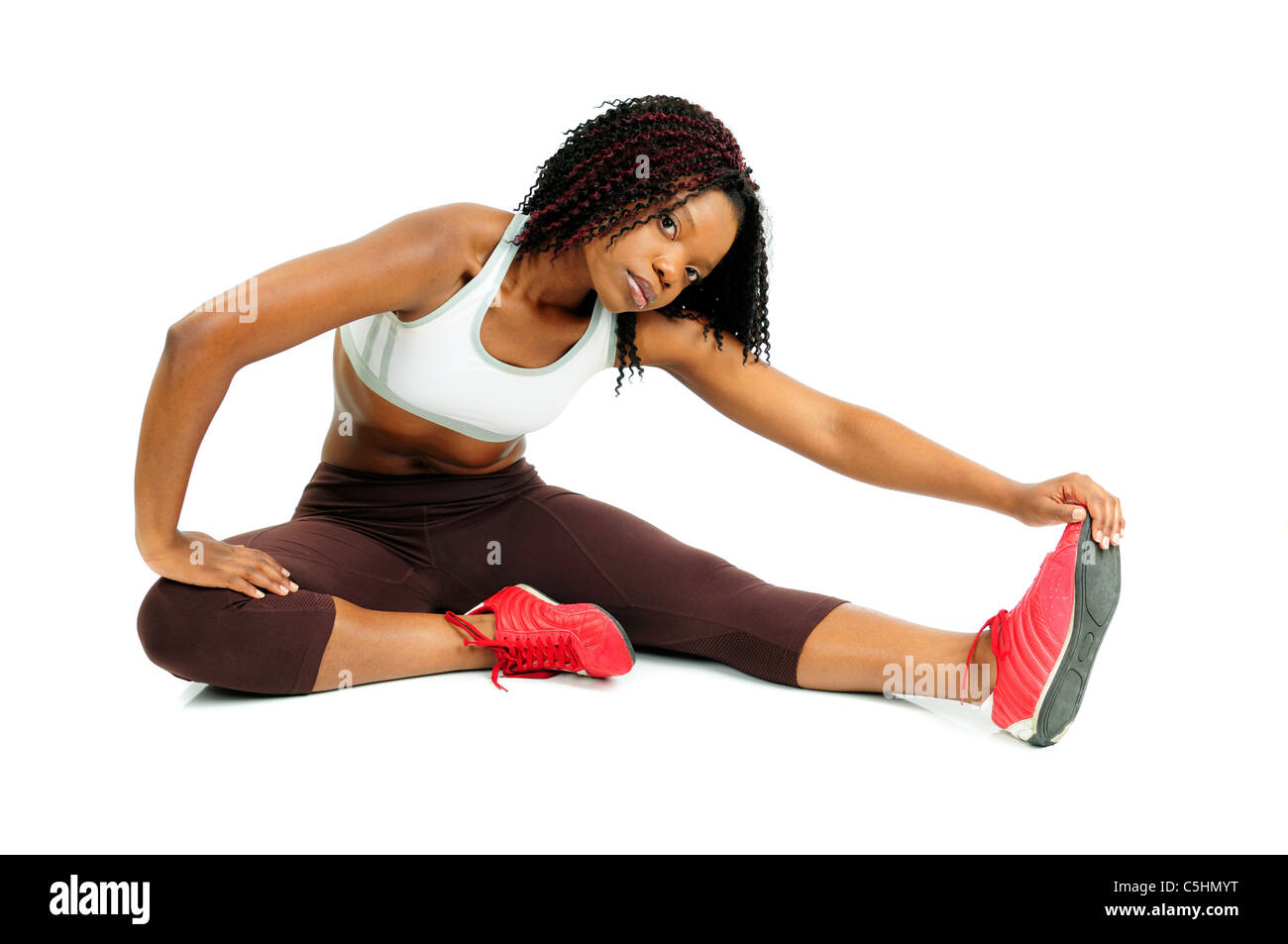 African American Woman Dressed For Fitness Stretching At The Gym Before