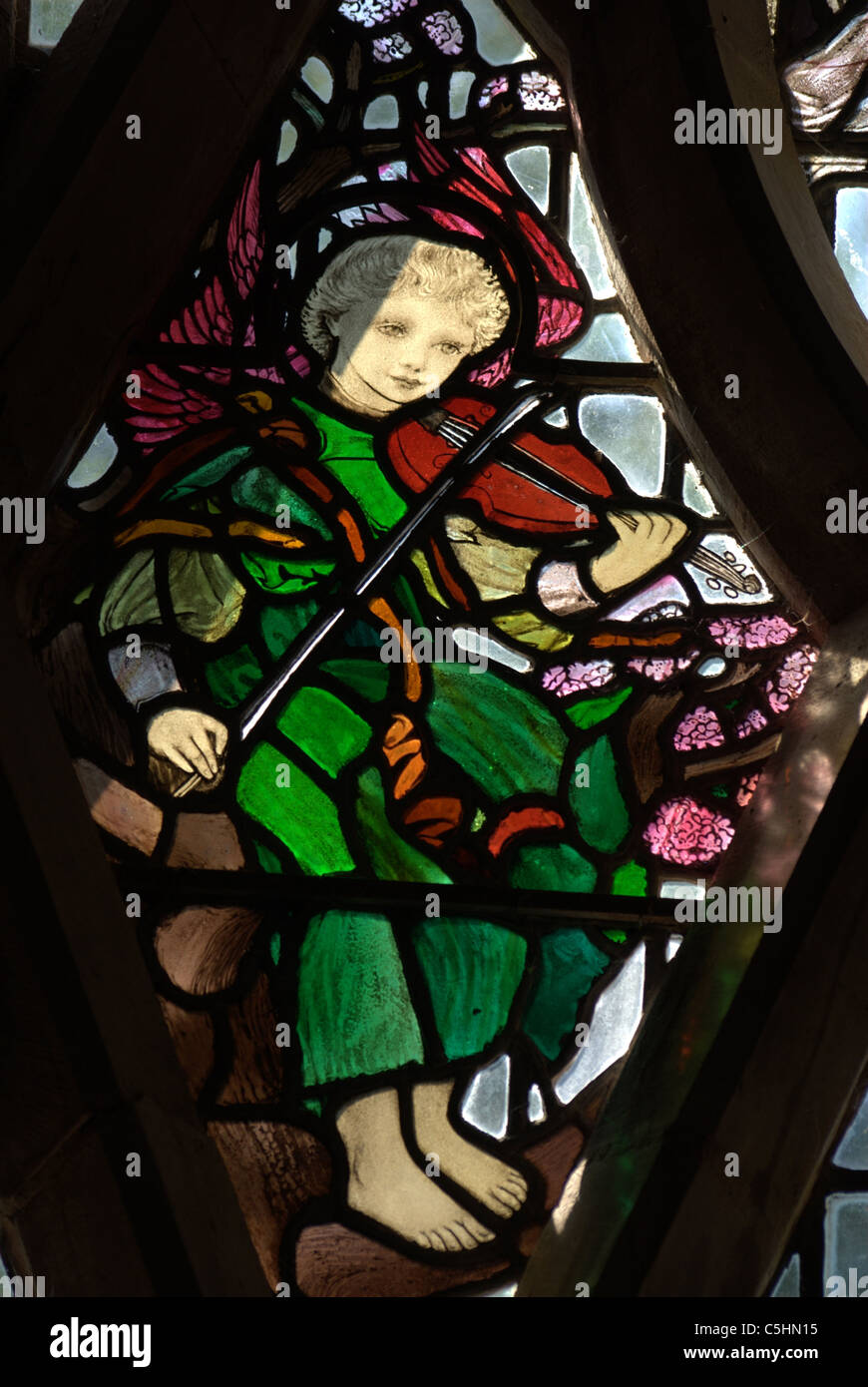 Section of stained glass depicting a musician Stock Photo