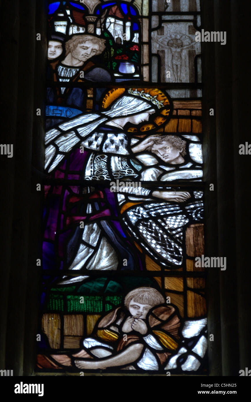A section of Stained glass depicting St.Margaret of Scotland caring for the suffering Stock Photo