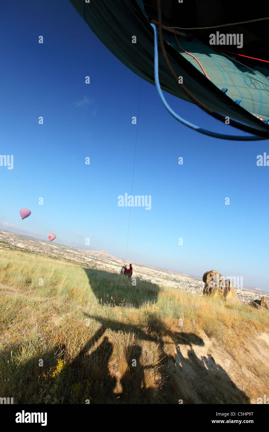 landing a Hot Air Balloon, balloons, ballooning over Cappadocia, Turkey Stock Photo